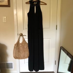 Black jumper with wide legs and a beaded neckline